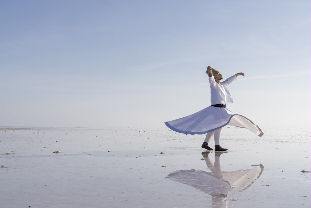 a dervish dancing on the sands