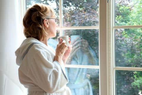 a woman looking out the window
