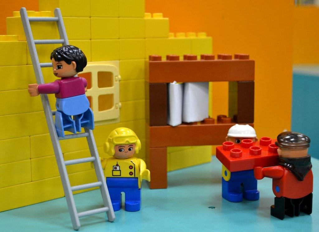 lego people fixing a house