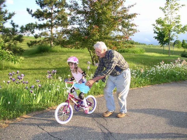 teaching a grand child how to ride a bike