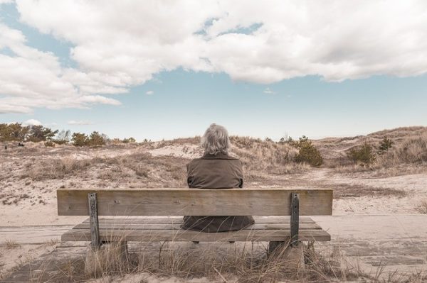 person outside on a bench