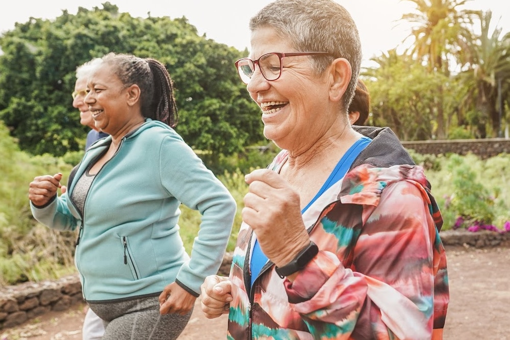 women over 40 laughing and getting exercise to benefit her mental health