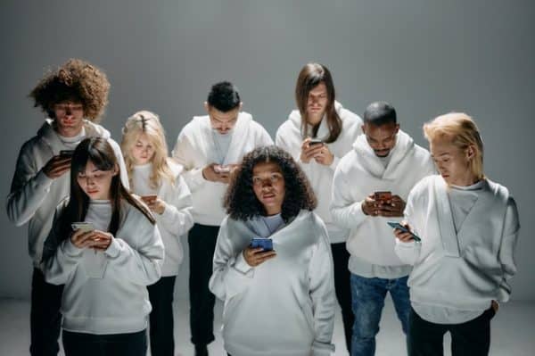 group of people on their cell phones