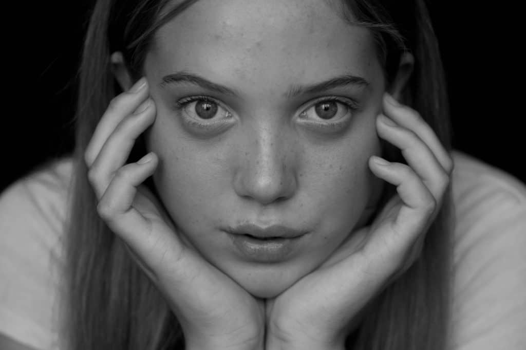 woman with her face in her hands