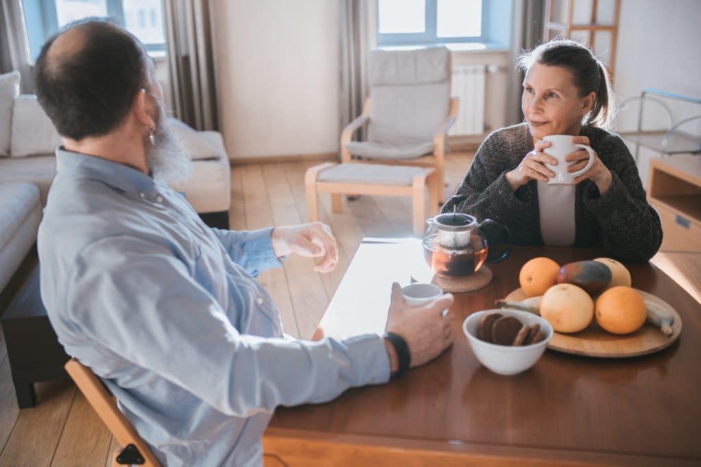 people talking at a table