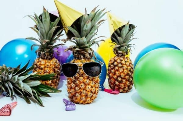 pineapples wearing sunglass party decor