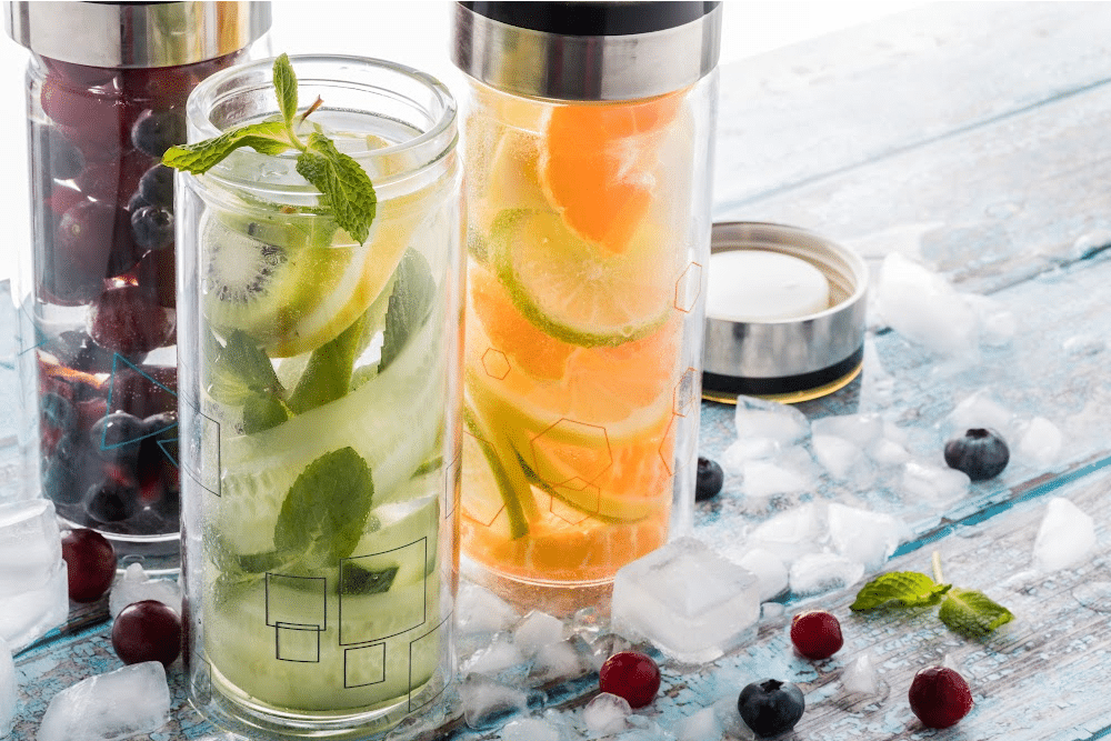 fruit infused water for vitamins and hydration for healthy aging. mint kiwi orange lemon lime blueberries raspberries