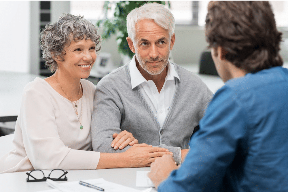 empty nest couple meeting with a financial planner to discuss planning for retirement and long term care