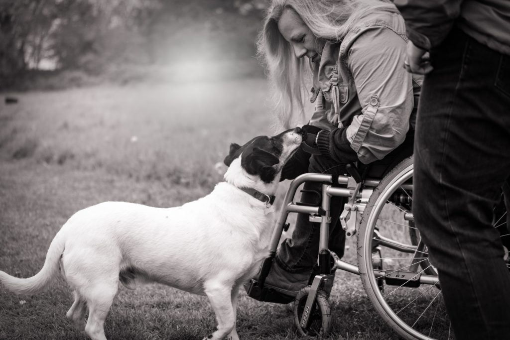 woman with a spinal cord injury and her dog