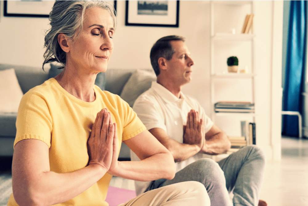 woman over 50 and a man centering themselves as part of mindful spring cleaning ritual
