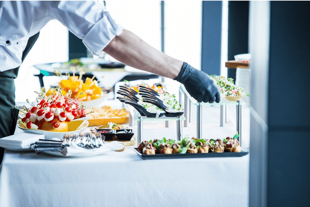 caterer setting up a buffet at business events