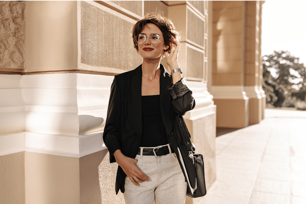 stylish women over 40 wearing casual staples and glasses to create a classic black and white business look