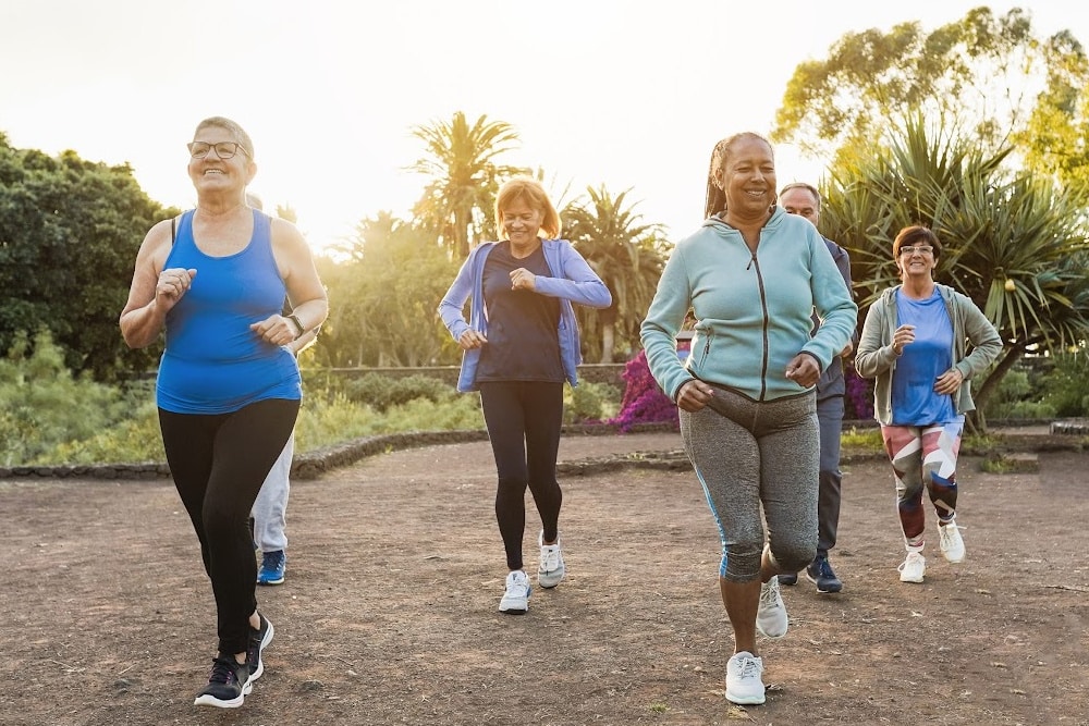group of women over 40 exercising to transform their mindset with socializing and exercise