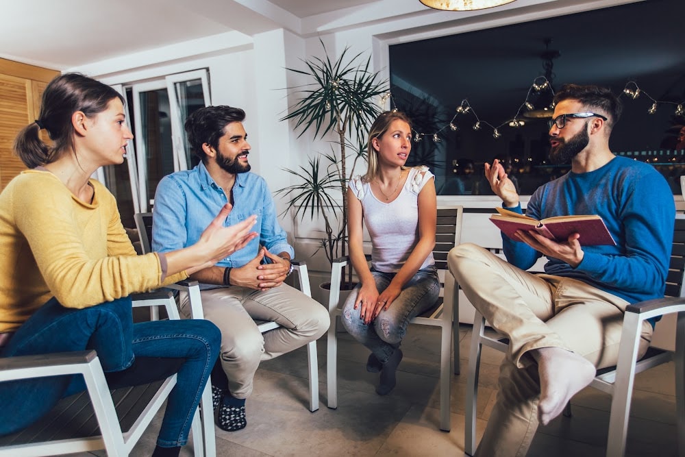 diverse group of people in their late 20's in a 12 step program