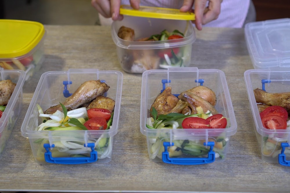a woman over 40 preparing meals for the family before surgery