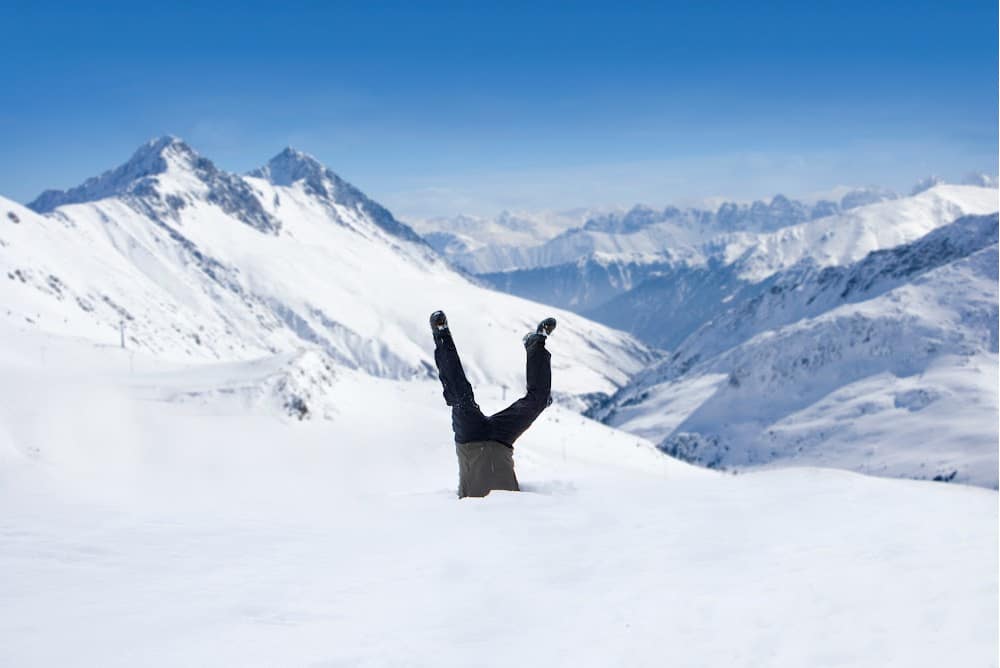 lazy snow removal hack lol man standing on his head in the snow