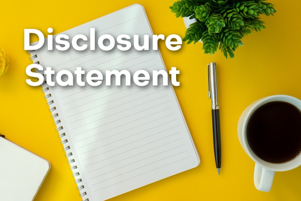 notebook pen coffee and the words disclosure statement