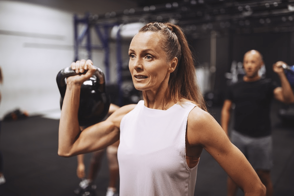 woman over 50 lifting weights